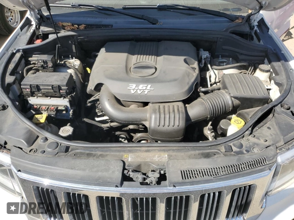 2012 Jeep Grand Cherokee Laredo with VIN 1C4RJEAG0CC222943, listed as a Copart auction lot 52899545 with 153,389 mi miles and Salvage Title. Bid and sale history available at carsss.com. Image 12.