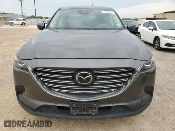 2021 Mazda CX-9 Touring z VIN JM3TCACY1M0502783, wystawiony jako Copart lot #53551935 z przebiegiem 71 373 mil mil oraz Czysty tytuł • Clean title. Historia ofert i sprzedaży dostępna na DreamBid. Obrazek 5.