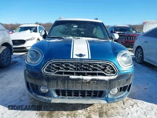 2018 MINI Countryman Cooper S with VIN WMZYT5C3XJ3E61612, listed as a IAAI auction lot 41276107 with 59,554 mi miles and . Bid and sale history available at DreamBid. Image 13.
