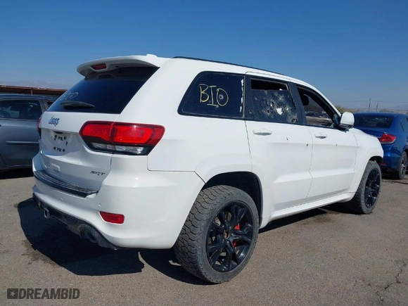 2015 Jeep Grand Cherokee SRT with VIN 1C4RJFDJ4FC122071, listed as a IAAI auction lot 41455849 with 251,476 mi miles. Bid and sale history available at carsss.com. Image 4.