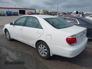 2005 Toyota Camry LE with VIN 4T1BF32K55U083752, listed as a IAAI auction lot 42145407 with 229,838 mi miles and . Bid and sale history available at DreamBid. Image 3.