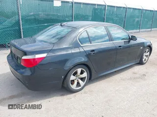 2007 BMW 5 Series 530i with VIN WBANE73597CM56897, listed as a IAAI auction lot 42113113 with 212,774 mi miles. Bid and sale history available at carsss.com. Image 4.