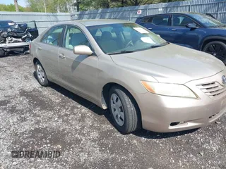 2007 Toyota Camry CE with VIN 4T1BE46K77U035661, listed as a IAAI auction lot 42190821 with 143,544 mi miles. Bid and sale history available at carsss.com. Image 1.