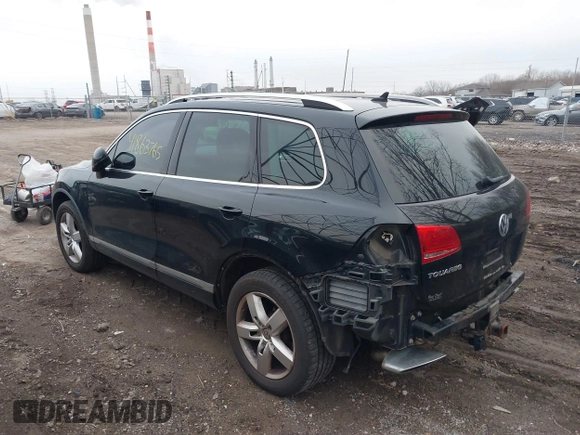 2012 Volkswagen Touareg Sport with VIN WVGFK9BP7CD002243, listed as a IAAI auction lot 41863765 with 136,231 mi miles and . Bid and sale history available at DreamBid. Image 3.