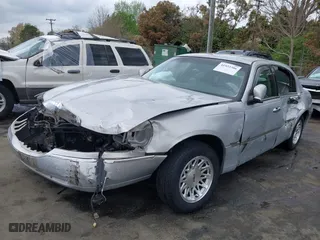 1999 Lincoln Town Car Signature with VIN 1LNFM82W6XY608644, listed as a IAAI auction lot 41922386 with 1 mi miles. Bid and sale history available at carsss.com. Image 17.