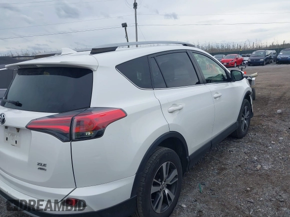 2018 Toyota RAV4 XLE with VIN JTMRFREV8JJ225065, listed as a IAAI auction lot 41940678 with 145,074 mi miles. Bid and sale history available at carsss.com. Image 4.