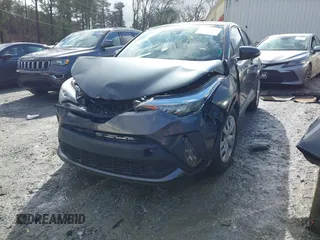 2021 Toyota C-HR LE with VIN NMTKHMBX9MR128998, listed as a IAAI auction lot 41575235 with 96,908 mi miles. Bid and sale history available at carsss.com. Image 2.
