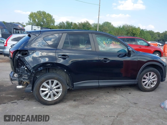 2016 Mazda CX-5 Touring with VIN JM3KE2CY5G0653108, listed as a IAAI auction lot 37717249 with 90,704 mi miles and . Bid and sale history available at DreamBid. Image 14.