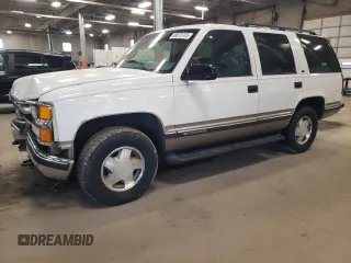 1999 Chevrolet Tahoe Z71 with VIN 1GNEK13R8XJ476282, listed as a Copart auction lot 48573705 with 207,260 mi miles and Salvage Title. Bid and sale history available at DreamBid. Image 1.