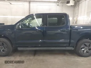 2023 Ford F-150 Lightning Pro with VIN 1FTVW1EL4PWG22900, listed as a IAAI auction lot 42139391 with 6,569 mi miles and . Bid and sale history available at DreamBid. Image 15.