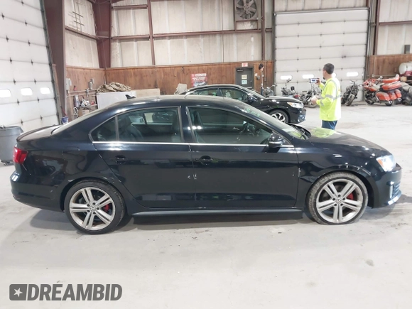 2015 Volkswagen Jetta Sedan 2.0T GLI SE with VIN 3VW5T7AJ0FM275867, listed as a IAAI auction lot 42133491 with 98,718 mi miles. Bid and sale history available at carsss.com. Image 14.