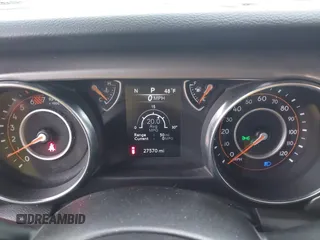 2023 Jeep Wrangler Sport with VIN 1C4HJXDG9PW631109, listed as a IAAI auction lot 41149861 with 27,570 mi miles and . Bid and sale history available at DreamBid. Image 7.