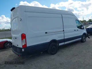 2021 Ford Transit Cargo with VIN 1FTBW3X8XMKA14051, listed as a IAAI auction lot 41672248 with 127,438 mi miles. Bid and sale history available at carsss.com. Image 4.
