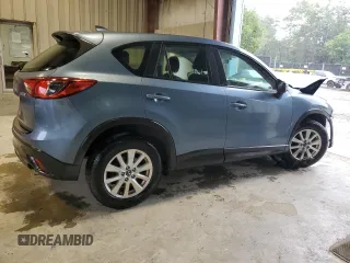 2016 Mazda CX-5 Sport z VIN JM3KE4BY0G0628372, wystawiony jako Copart lot #57534785 z przebiegiem 152 487 mil mil oraz Szkoda całkowita • Salvage title. Historia ofert i sprzedaży dostępna na DreamBid. Obrazek 3.
