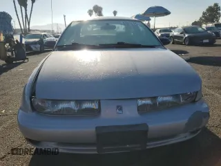 1999 Saturn SL with VIN 1G8ZK5274XZ367394, listed as a Copart auction lot 63863795 with 73,197 mi miles and Salvage title. Bid and sale history available at DreamBid. Image 5.