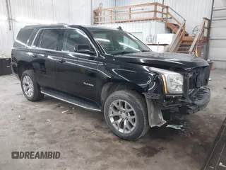 2016 GMC Yukon SLT with VIN 1GKS2BKC9GR176948, listed as a IAAI auction lot 41361221 with 125,178 mi miles. Bid and sale history available at carsss.com. Image 1.