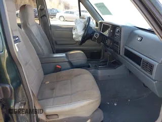 1996 Jeep Cherokee Sport with VIN 1J4FJ68S2TL299150, listed as a IAAI auction lot 41932867 with 142,761 mi miles. Bid and sale history available at carsss.com. Image 5.