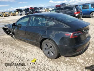2023 Tesla Model 3 with VIN 5YJ3E1EAXPF708001, listed as a Copart auction lot 57252735 with 71,579 mi miles and Salvage title. Bid and sale history available at DreamBid. Image 2.
