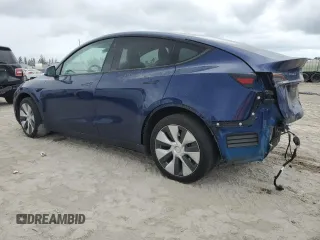 2023 Tesla Model Y Long Range z VIN 7SAYGDEE5PF787794, wystawiony jako Copart lot #55212605 z przebiegiem 30 277 mil mil oraz Szkoda całkowita • Salvage title. Historia ofert i sprzedaży dostępna na DreamBid. Obrazek 2.