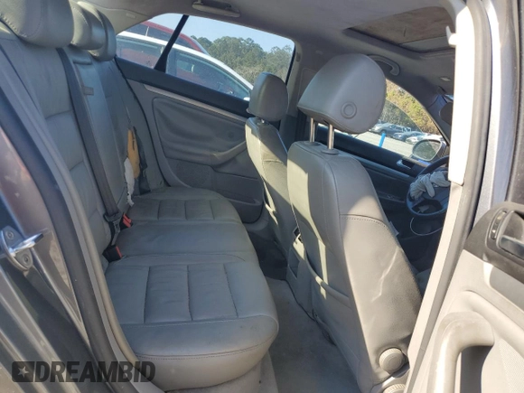 2006 Volkswagen Jetta z VIN 3VWDG71K26M673879, wystawiony jako Copart lot #75674634 z przebiegiem 93 689 mil mil oraz Szkoda całkowita • Salvage title. Historia ofert i sprzedaży dostępna na DreamBid. Obrazek 10.