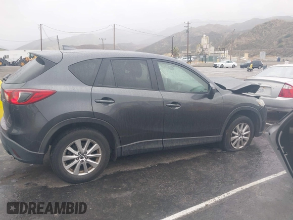 2016 Mazda CX-5 Touring with VIN JM3KE2CY7G0630056, listed as a IAAI auction lot 41817525 with 97,844 mi miles and . Bid and sale history available at DreamBid. Image 13.