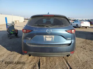 2020 Mazda CX-5 Grand Touring with VIN JM3KFBDM1L0727482, listed as a Copart auction lot 82976114 with 103,707 mi miles and Salvage Title. Bid and sale history available at carsss.com. Image 6.