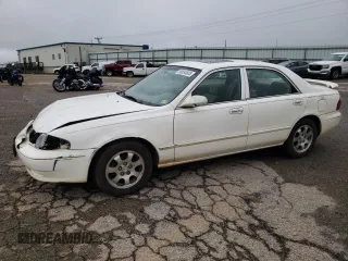 2001 Mazda 626 LX z VIN 1YVGF22C515251837, wystawiony jako Copart lot #56854605 z przebiegiem 173 148 mil mil oraz Szkody całkowita. Historia ofert i sprzedaży dostępna na DreamBid. Obrazek 1.