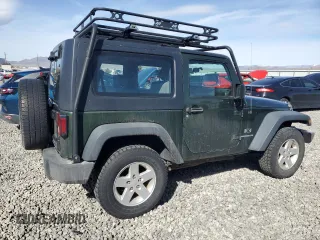 2009 Jeep Wrangler X with VIN 1J4FA24169L707695, listed as a Copart auction lot 49861955 with 89,807 mi miles and Salvage Title. Bid and sale history available at DreamBid. Image 3.
