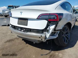 2020 Tesla Model 3 Standard Range Plus with VIN 5YJ3E1EA4LF644967, listed as a IAAI auction lot 41745984 with 23,479 mi miles. Bid and sale history available at carsss.com. Image 6.