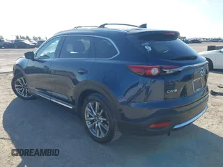 2016 Mazda CX-9 Grand Touring with VIN JM3TCADY6G0107064, listed as a IAAI auction lot 42580485 with 124,713 mi miles and . Bid and sale history available at DreamBid. Image 3.