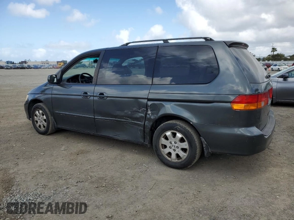 2004 Honda Odyssey EX-L with VIN 5FNRL18944B052617, listed as a Copart auction lot 51443625 with 144,346 mi miles and Salvage Title. Bid and sale history available at DreamBid. Image 2.
