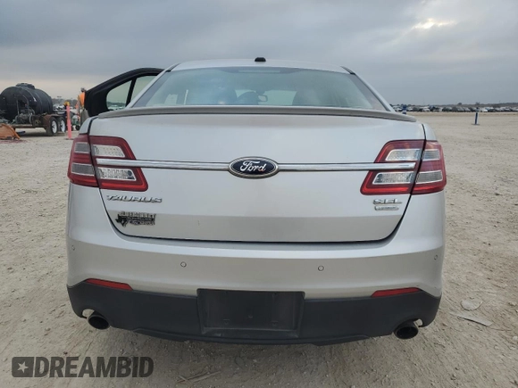 2013 Ford Taurus SEL with VIN 1FAHP2E98DG150183, listed as a Copart auction lot 87481264 with 74,065 mi miles and Salvage Title. Bid and sale history available at DreamBid. Image 6.
