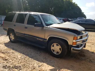 1999 Chevrolet Tahoe Z71 with VIN 1GNEK13R1XJ315188, listed as a Copart auction lot 68498944 with 264,880 mi miles and Salvage Title. Bid and sale history available at carsss.com. Image 4.