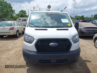 2024 Ford Transit Cargo with VIN 1FTBR1Y89RKA01132, listed as a IAAI auction lot 42668811 with 31,666 mi miles and . Bid and sale history available at DreamBid. Image 12.