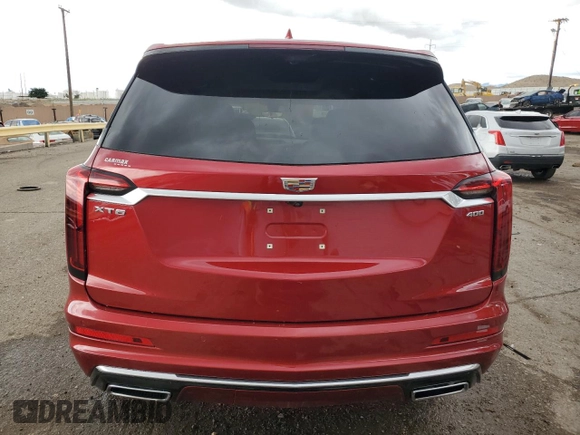 2024 Cadillac XT6 FWD Premium Luxury with VIN 1GYKPCRS1RZ700168, listed as a Copart auction lot 59327055 with 21,001 mi miles and Salvage title. Bid and sale history available at DreamBid. Image 6.