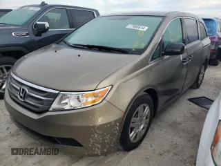 2012 Honda Odyssey LX with VIN 5FNRL5H21CB061199, listed as a Copart auction lot 77980614 with 80,249 mi miles and Salvage Title. Bid and sale history available at carsss.com. Image 1.