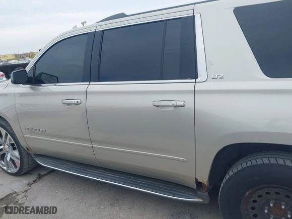 2015 Chevrolet Suburban LTZ with VIN 1GNSKKKC0FR525772, listed as a IAAI auction lot 41745084 with 187,981 mi miles. Bid and sale history available at carsss.com. Image 14.