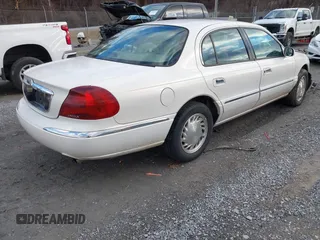 1998 Lincoln Continental with VIN 1LNFM97VXWY619313, listed as a IAAI auction lot 41477852 with 158,973 mi miles. Bid and sale history available at carsss.com. Image 4.