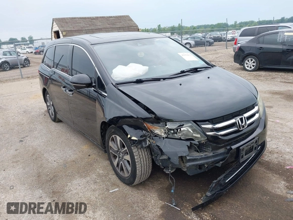 2015 Honda Odyssey Touring Elite with VIN 5FNRL5H97FB124565, listed as a IAAI auction lot 42358412 with 206,444 mi miles and . Bid and sale history available at DreamBid. Image 1.