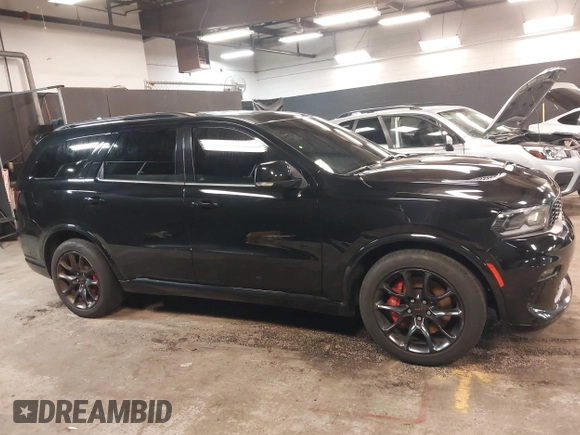 2023 Dodge Durango R/T Plus with VIN 1C4SDJCT8PC571642, listed as a IAAI auction lot 42093743 with 33,631 mi miles and . Bid and sale history available at DreamBid. Image 13.