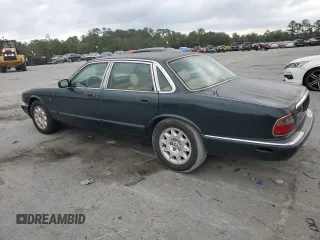 1999 Jaguar XJ with VIN SAJHX1044XC865054, listed as a Copart auction lot 57825325 with 71,145 mi miles and Clean title. Bid and sale history available at DreamBid. Image 2.