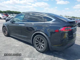 2017 Tesla Model X 90D with VIN 5YJXCBE21HF054898, listed as a IAAI auction lot 42076462 with 89,996 mi miles and . Bid and sale history available at DreamBid. Image 3.