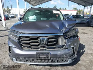 2025 Honda Pilot Touring with VIN 5FNYG2H73SB004351, listed as a IAAI auction lot 41699830 with 6,377 mi miles. Bid and sale history available at carsss.com. Image 12.