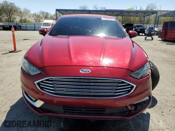 2017 Ford Fusion SE z VIN 3FA6P0H77HR413851, wystawiony jako Copart lot #51806965 z przebiegiem 98 269 mil mil oraz Szkoda całkowita • Salvage title. Historia ofert i sprzedaży dostępna na DreamBid. Obrazek 5.