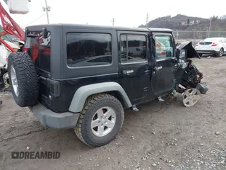 2011 Jeep Wrangler Unlimited Sport with VIN 1J4BA3H17BL552319, listed as a IAAI auction lot 41747031 with 120,751 mi miles. Bid and sale history available at carsss.com. Image 4.