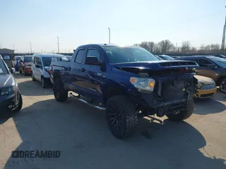 2014 Toyota Tundra 4WD Truck SR with VIN 5TFUY5F1XEX379823, listed as a IAAI auction lot 41761483 with 131,987 mi miles. Bid and sale history available at carsss.com. Image 1.