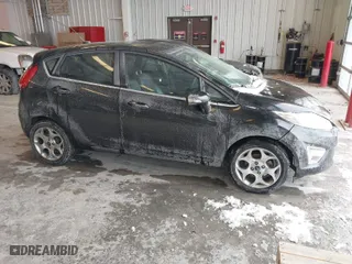 2011 Ford Fiesta SES with VIN 3FADP4FJ7BM196559, listed as a IAAI auction lot 41527976 with 65,861 mi miles. Bid and sale history available at carsss.com. Image 1.