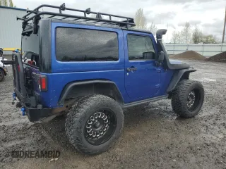 2009 Jeep Wrangler X with VIN 1J4FA24179L700884, listed as a Copart auction lot 52194055 with 96,189 mi miles and Salvage Title. Bid and sale history available at DreamBid. Image 3.
