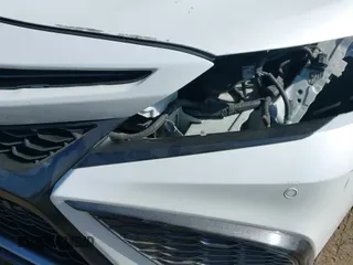 2022 Toyota Camry TRD z VIN 4T1KZ1AK9NU071181, wystawiony jako IAAI lot #41758219 z przebiegiem 103 200 mil mil oraz . Historia ofert i sprzedaży dostępna na DreamBid. Obrazek 20.