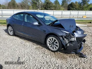 2022 Tesla Model 3 with VIN 5YJ3E1EA4NF371483, listed as a Copart auction lot 49287665 with 59,476 mi miles and Salvage Title. Bid and sale history available at DreamBid. Image 4.